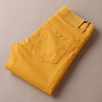 个性时尚亮色牛仔裤春季修身型青年长裤黄色 韩版男士弹力小脚裤